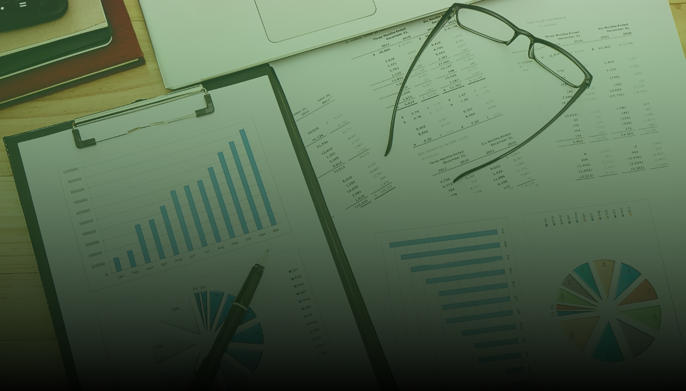 desk with graphs and accounting forms